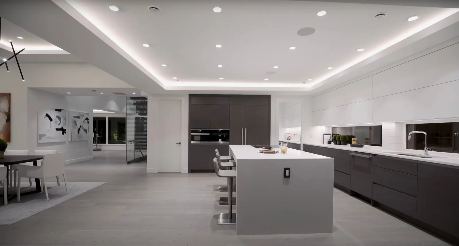 Open-plan kitchen with waterfall island in a Lincoln Square condominium, Upper West Side